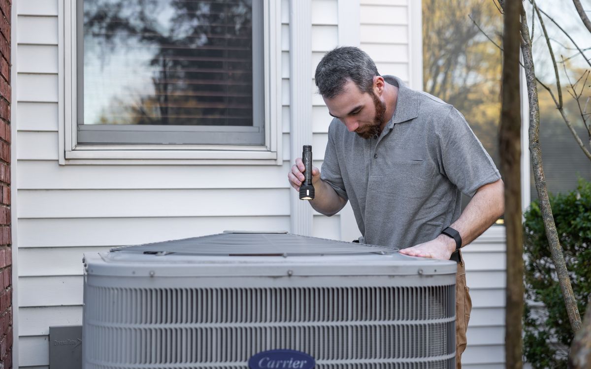 HVAC technician servicing a furnace