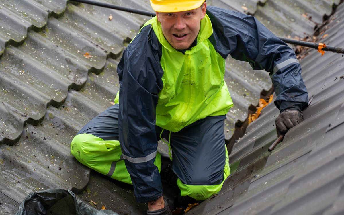 Roofing crew laying shingles